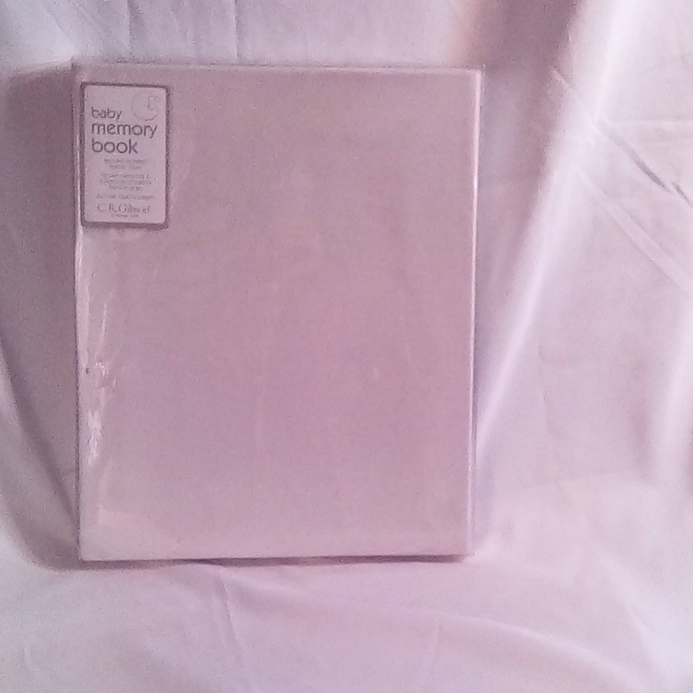 This is a brand new pink leather baby book